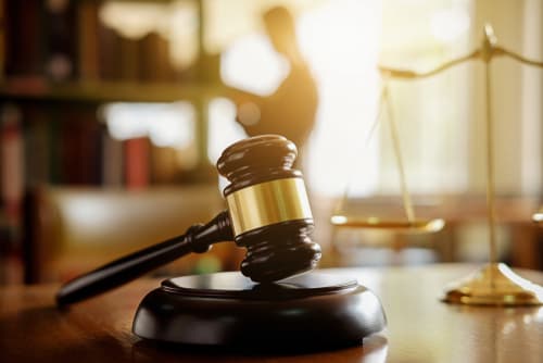 gavel and scales of justice on desk