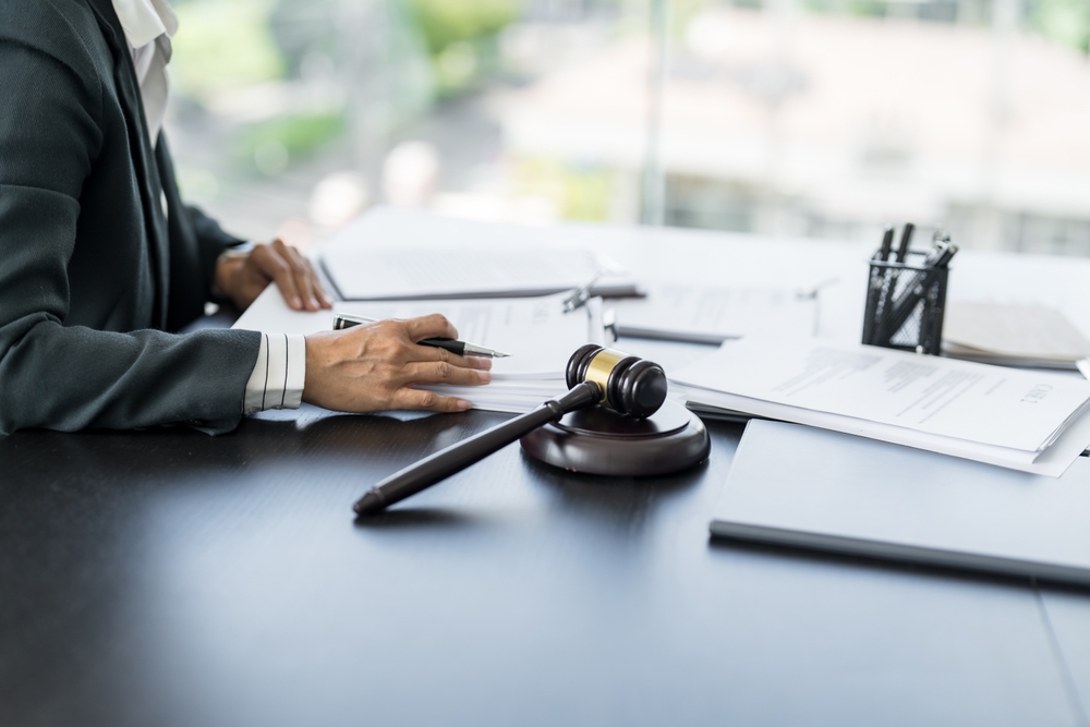 Attorney reviewing legal documents at a desk, representing cases handled by Greenville criminal defense lawyers.